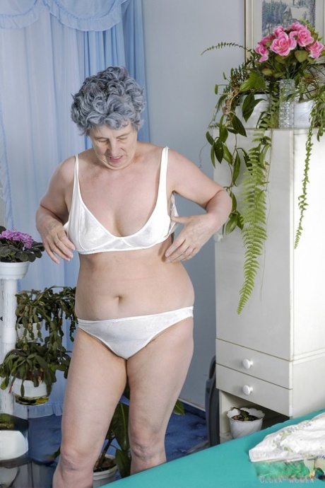 Chubby granny presents her natural tits and toys her hairy vagina with a vase