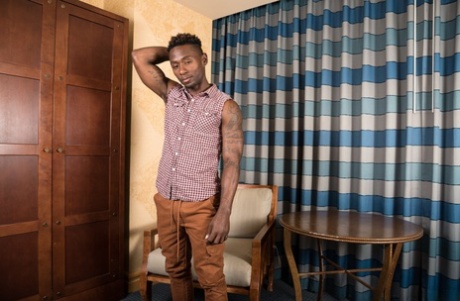 Stunning black dude Miller Axton reveals his huge boner and poses on a chair