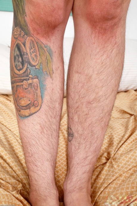 Brunette with tattoos Valkyree Jaine shows her hairy body & plays with a toy