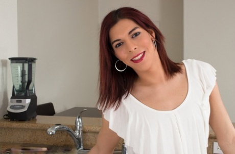 Adorable skinny shemale Kendra Sinclaire pulls out her dick in the kitchen