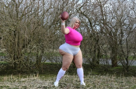 Curvaceous football player Natasha Crown flaunts her huge ass outdoors
