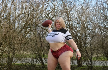 Curvaceous football player Natasha Crown flaunts her huge ass outdoors