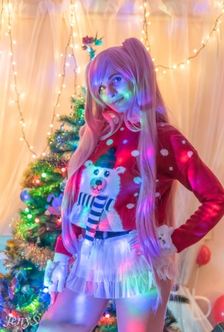 Cosplay babe Jeny Smith shows her pussy in an upskirt by the Christmas tree