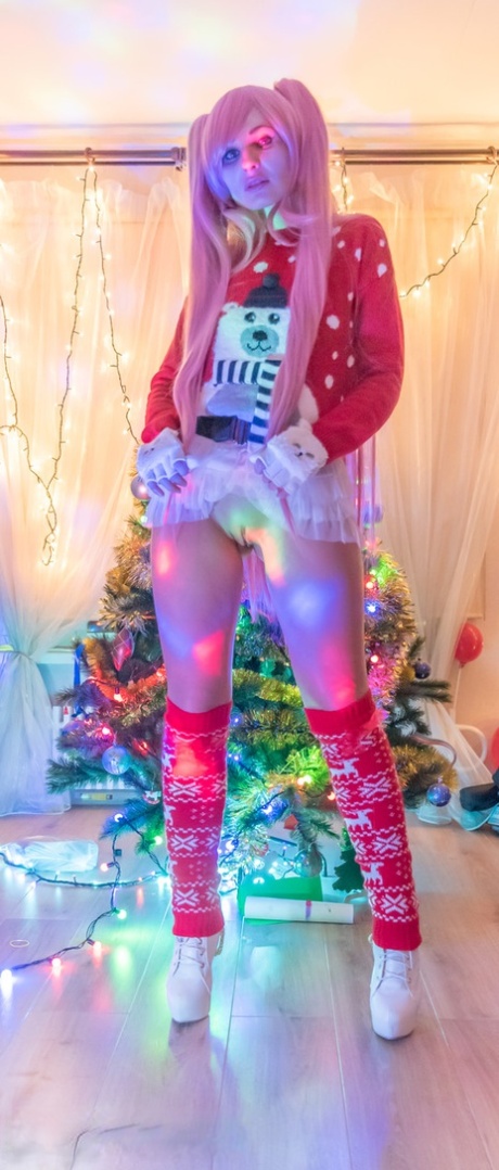 Cosplay babe Jeny Smith shows her pussy in an upskirt by the Christmas tree