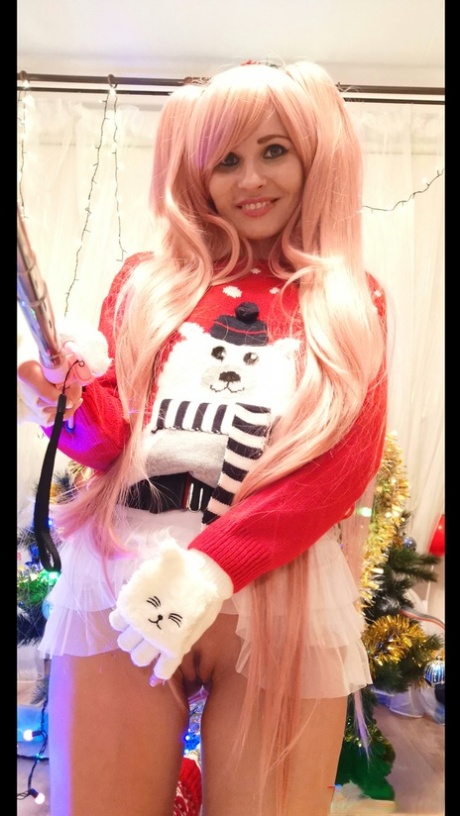 Cosplay babe Jeny Smith shows her pussy in an upskirt by the Christmas tree