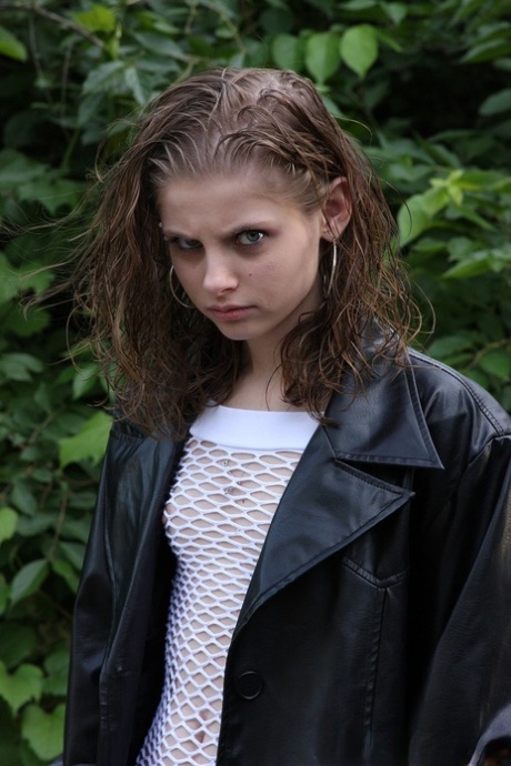 Sexy babe Lil Candy poses bottomless in her sheer top & leather jacket