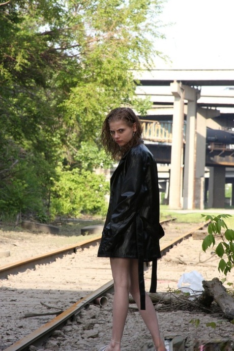 Sexy babe Lil Candy poses bottomless in her sheer top & leather jacket