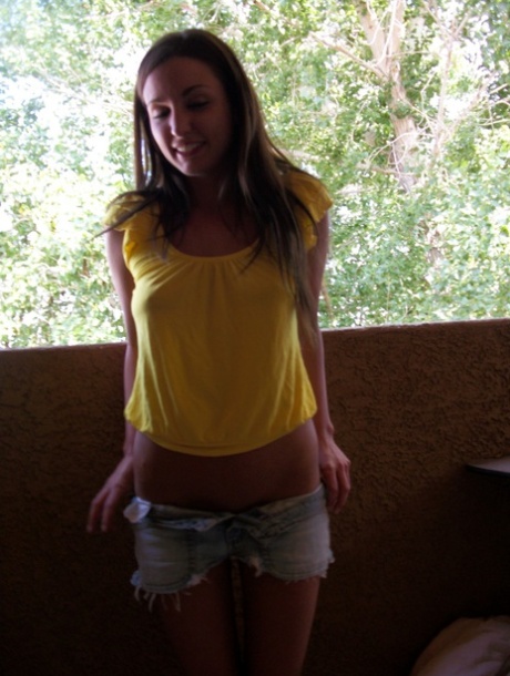 Cute brunette teen shows off her lovely tits and her perfect booty
