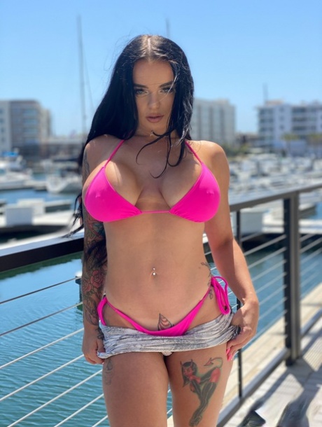Curvaceous stunner Payton Preslee flaunting her huge melons in a pink bikini