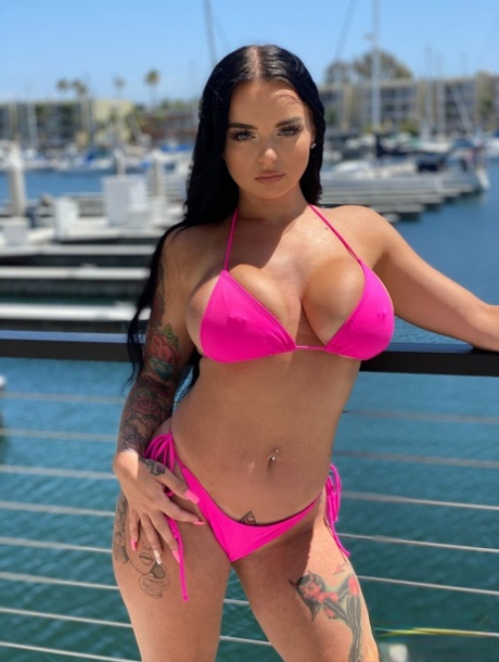 Curvaceous stunner Payton Preslee flaunting her huge melons in a pink bikini