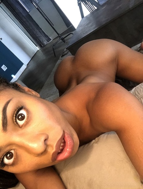 Ebony with dreads Kira Noir unveils her tiny tits and sweet ass in a solo