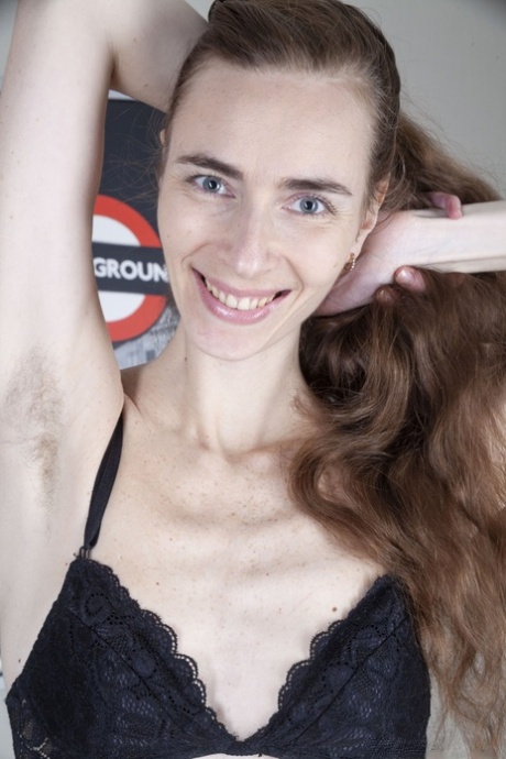Filthy amateur with long legs Pretty rubs her hairy beaver in a solo