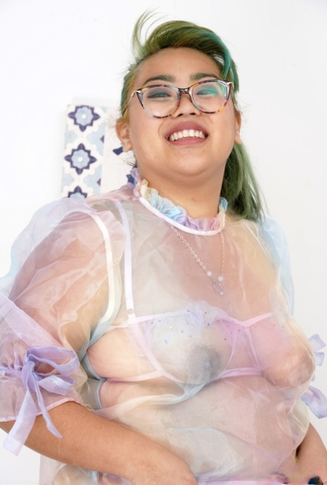 Curvy Manila Bey spreads her hairy pussy while showing off her chubby body