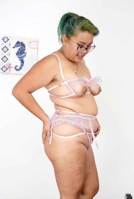 Curvy Manila Bey spreads her hairy pussy while showing off her chubby body