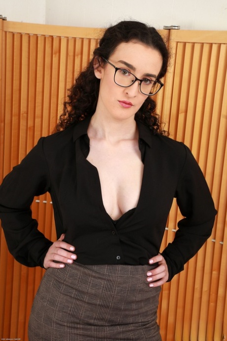 Sexy nerdy amateur Lyra Lockhart exposes her big tits and hairy pussy