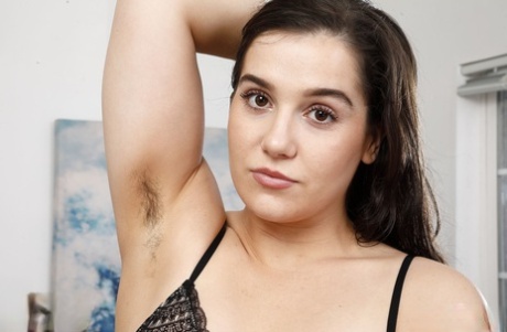 Brunette bombshell Kasey Warner spreads her trimmed pussy up close