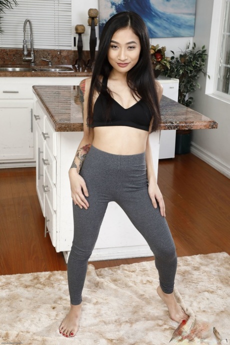 Little Asian brunette Avery Black playing with her meaty pussy up close