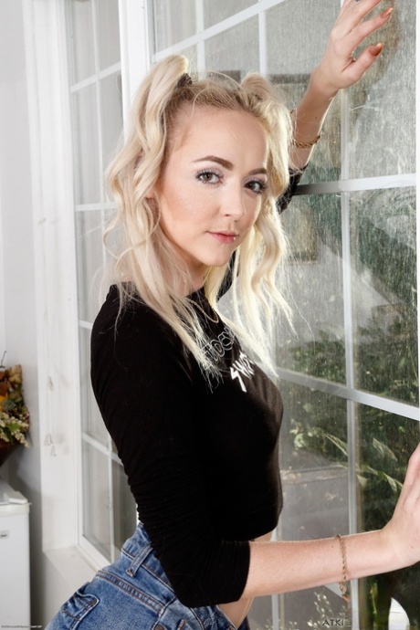 Short blonde Iris Rose strips and shows her pierced holes up close
