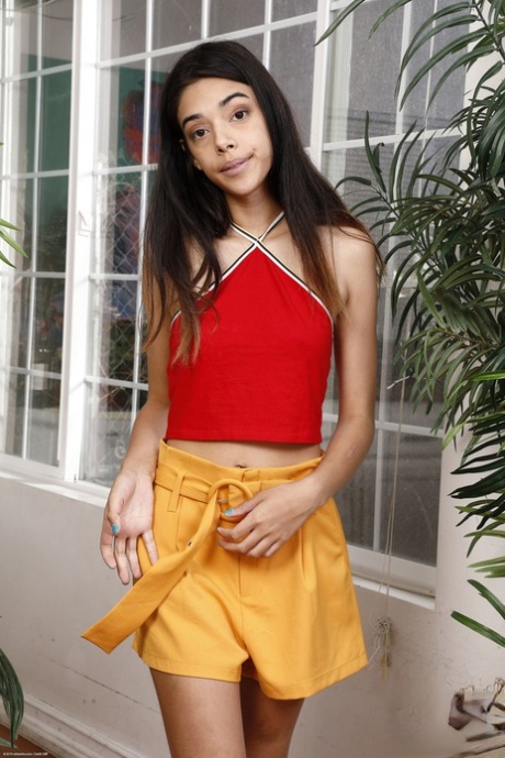 Raven-haired babe Harmony Wonder displays her big ass & holes up close