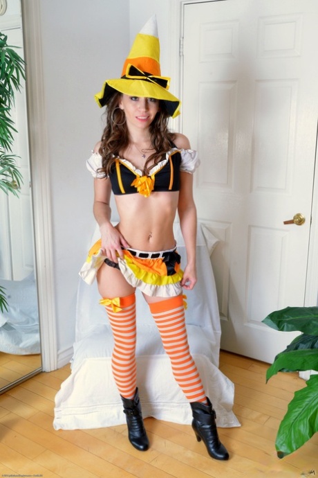 Naughty girl in a witch costume exposes her bubble ass and spreads her holes