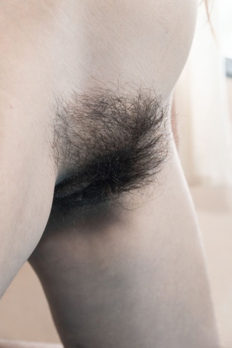 Lovely brunette amateur Paris spreads her deliciously hairy pussy up close
