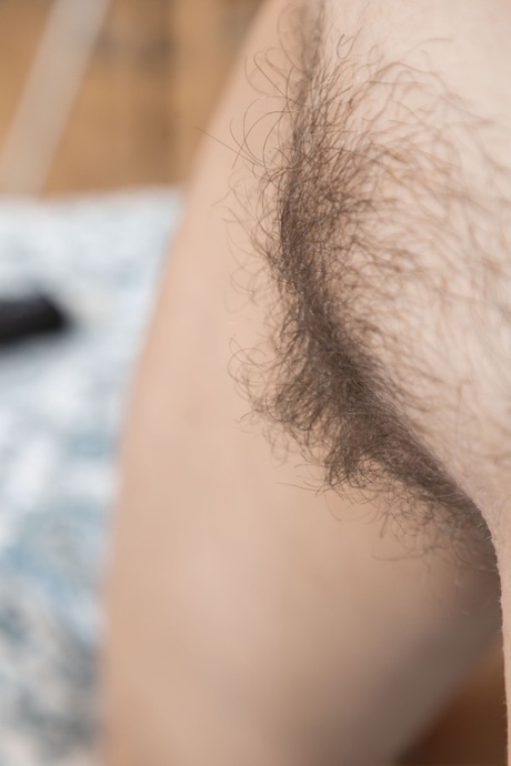 Slim amateur Victoria exposes her wonderful tits and hairy pussy on a bed