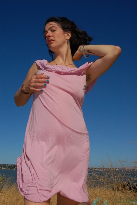 Amateur female with hairy armpits Sadie Lune exposes her bush and small tits