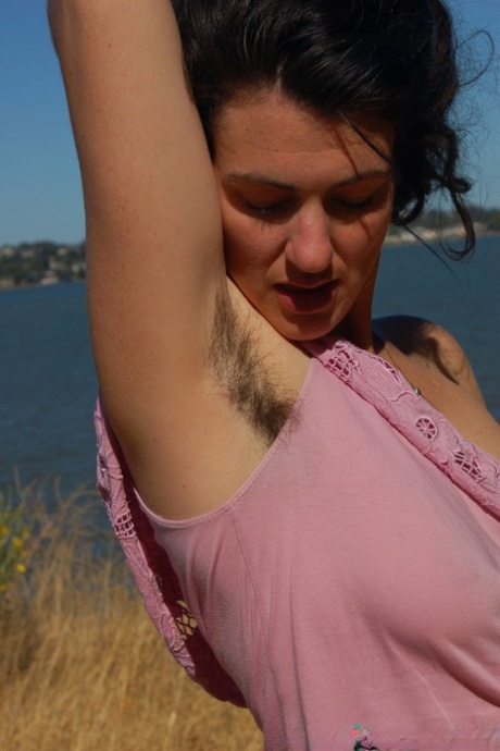 Amateur female with hairy armpits Sadie Lune exposes her bush and small tits