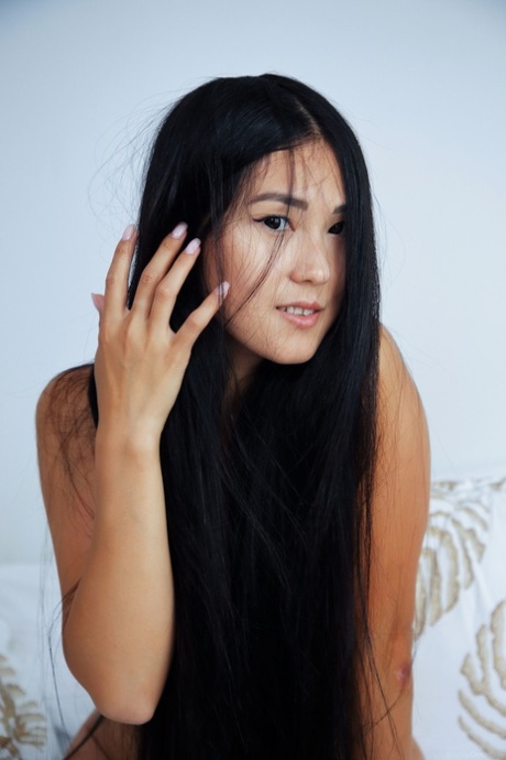 Glamorous Asian teen babe Kenia H exposing her big ass & holes on the bed