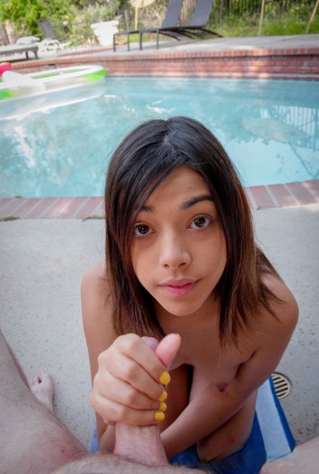 Short American Harmony Wonder gives a sloppy handjob & gets facialed poolside