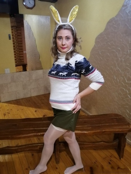 Amateur wife with bunny ears posing in her white nylon stockings