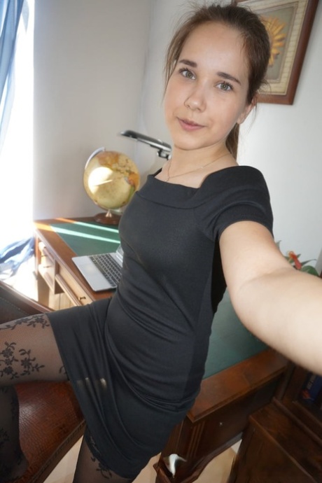 Beautiful amateur takes hot nude selfies while trying out her sexy outfits