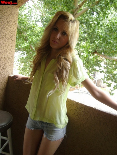 Petite blonde WouJ shows off her sexy legs and her hot ass in booty shorts