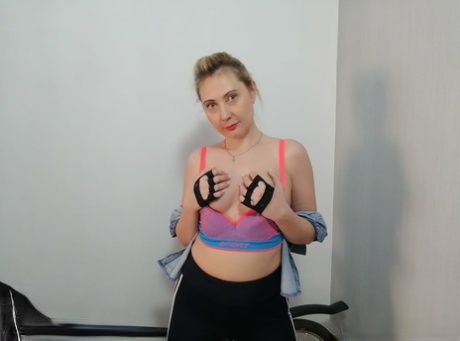Curvy amateur cyclist undressing and posing naked on her bicycle
