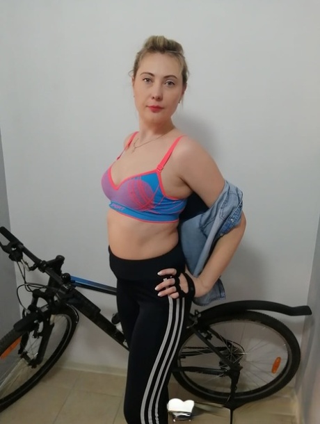 Curvy amateur cyclist undressing and posing naked on her bicycle