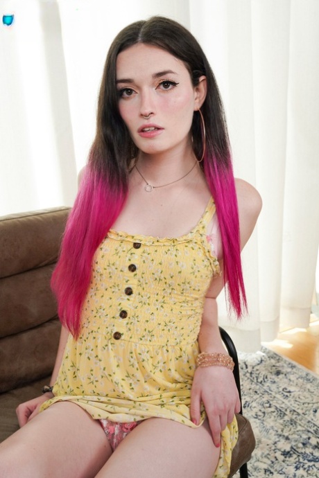 Pretty shemale Natalie Stone strips in a solo & shows her dick & tits