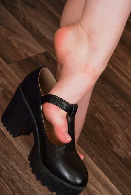 Cute redheaded shemale Shiri shows her hot feet, big ass & hard dick