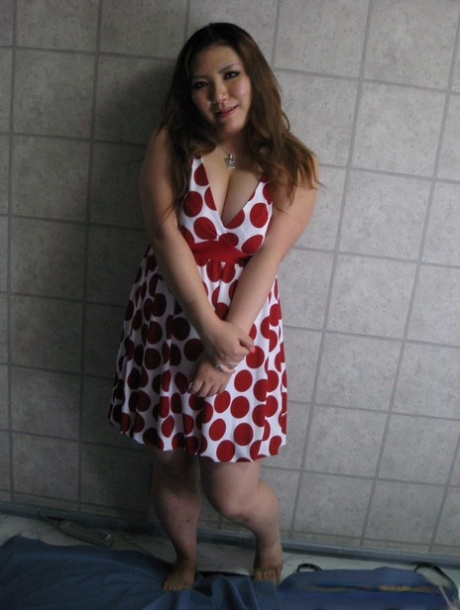 Chubby Asian exposes her huge juggs and massive ass in amateur action
