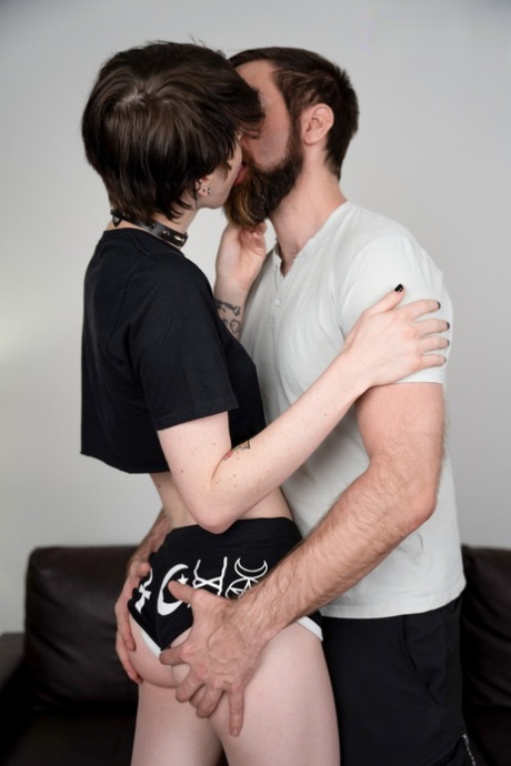 Skinny emo shemale kisses a bearded gay and takes his dick from behind