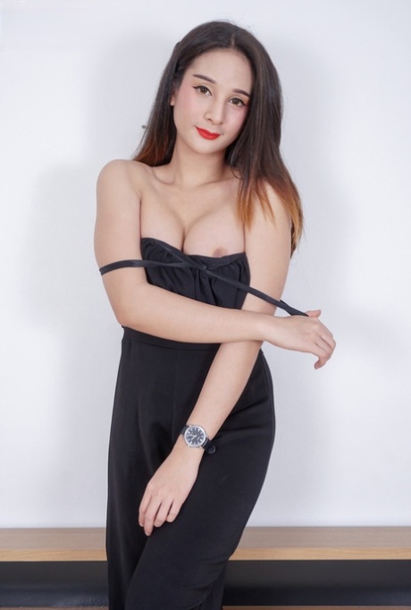 Pretty shemale Toto shows off her round tits & her small dick on her bed