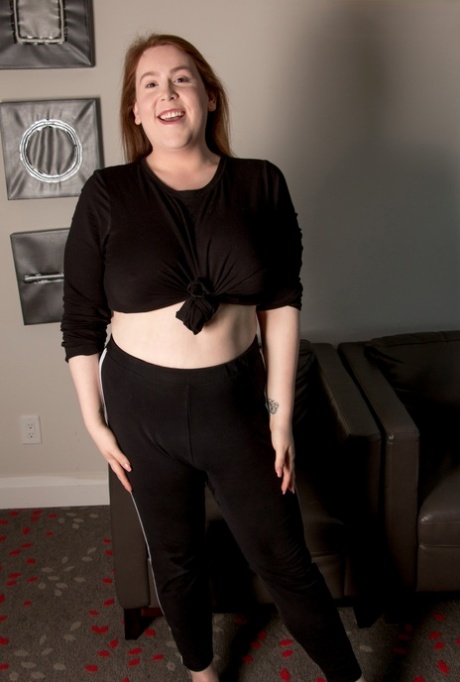Chubby shemale model Sutton Mercer unveils her big tits and fat dick