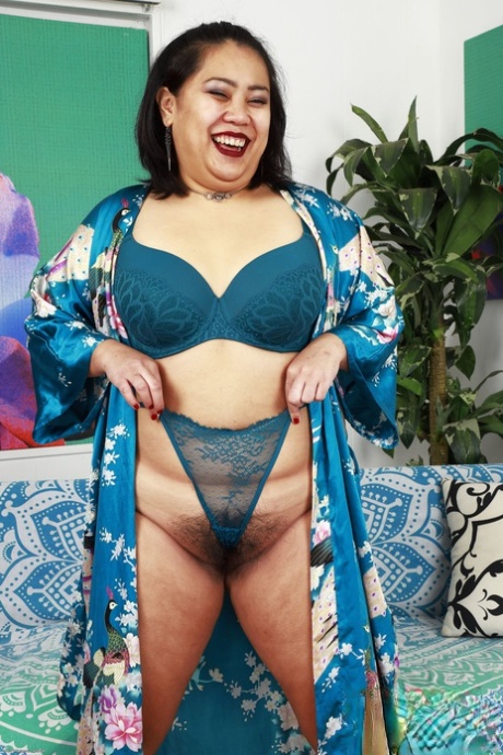 Chubby Asian slut Manila Bey shows off her big ass & hairy pussy in a solo