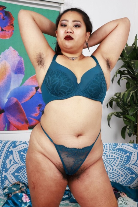 Chubby Asian slut Manila Bey shows off her big ass & hairy pussy in a solo
