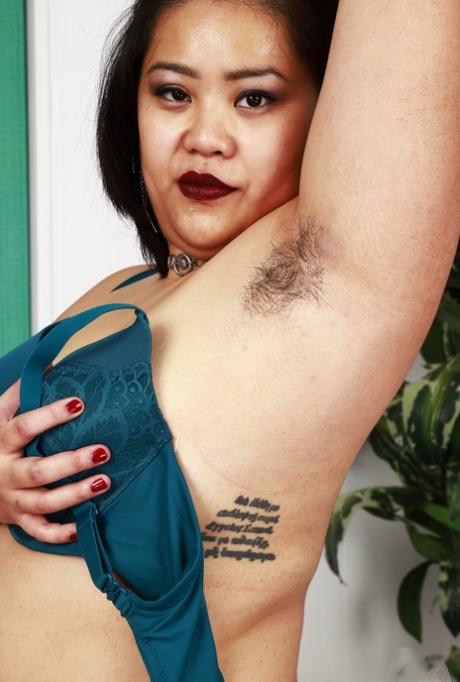 Chubby Asian slut Manila Bey shows off her big ass & hairy pussy in a solo