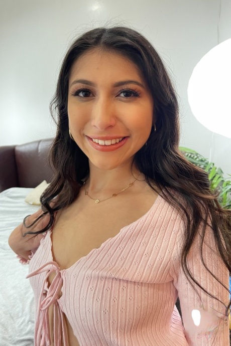 Lovely brunette Penelope Woods shows off her big booty and her puffy pussy