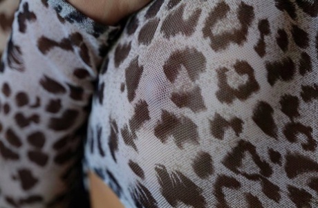 Adorable babe Vi Angel teases with her hot round ass in a sexy leopard outfit