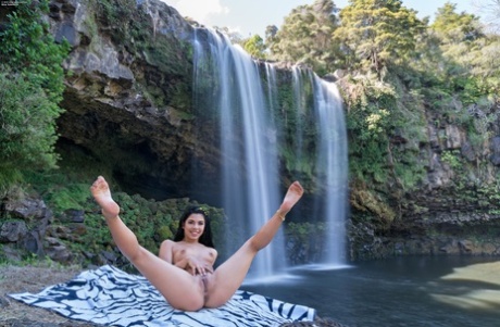 Hot Brazilian teen Gina Valentina strips & spreads her muff by the waterfalls