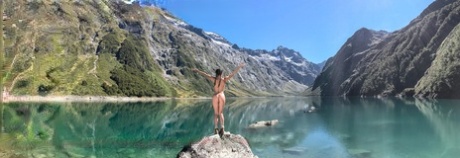 All-natural teen Lily Adams strips naked by the lake and sunbaths