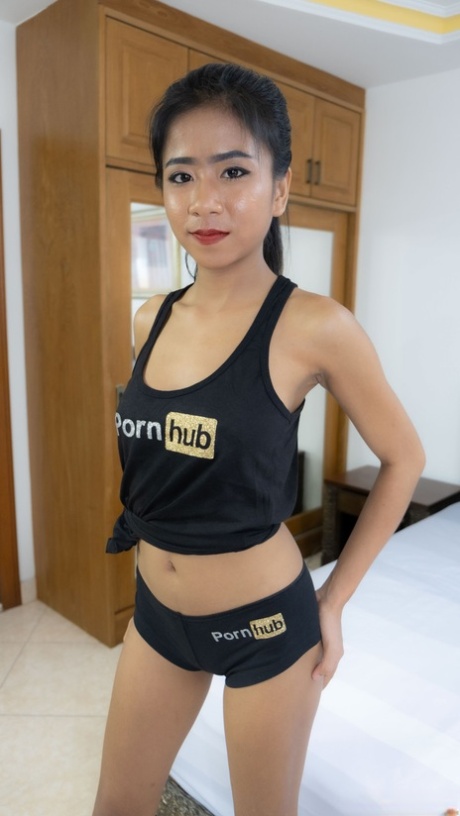 Thai beauty Som poses in her PornHub outfit & shows her big tits & ass
