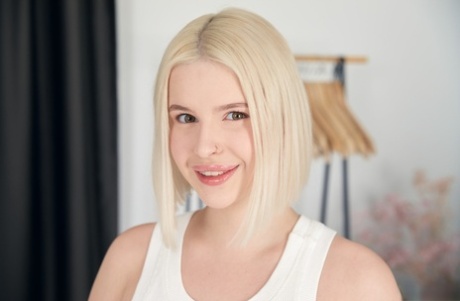 Sexy blonde teen Eliz Benson exposes her big tits and spreads her muff